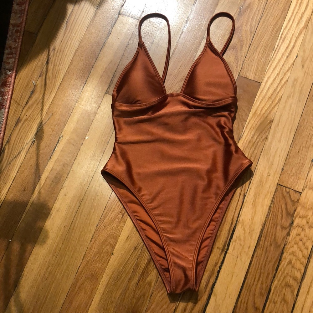 Brand new without tags, never worn forever 21 one piece bathing suit.